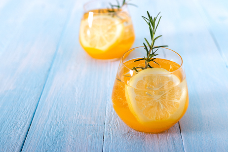 Lemon drink on white wooden background. health drink concept.の写真素材