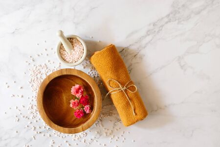 Top view of spa set with towels flower and stone. Relaxation concept