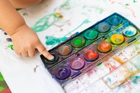 Child paint with watercolors. Education concept.の写真素材