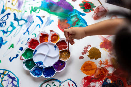Child paint with watercolors. Education concept.の写真素材
