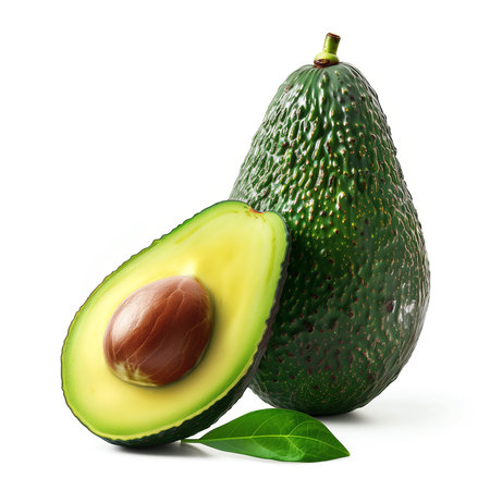 A vibrant and detailed image of a fresh avocado cut in half, showcasing the creamy texture and the glossy seed, with a green leaf accentの素材