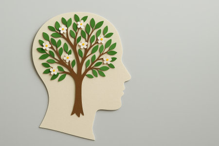 A mental health awareness tree head flower leaves growth nature conceptの素材