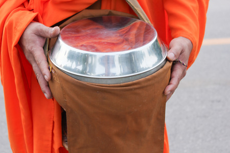 Give alms to a Buddhist monkの写真素材
