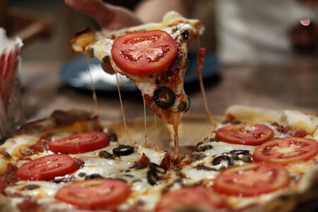 Anchovy cheese with tomatoes pizzaの写真素材