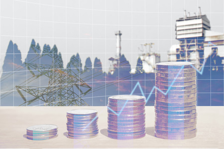 Double exposure of energy business and finance, Money coin stack with growing graph, Blurred power plant and electric pole background.の写真素材