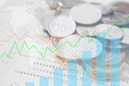 Double exposure of money coins with growing graph, Blurred world map background, Finance and banking concept.の写真素材
