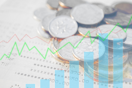 Double exposure of money coins with growing graph, Finance and banking concept.の写真素材