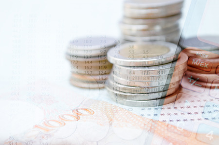 Double exposure coins with calculator, Saving money, Economy, Investment and Saving Concept.の写真素材