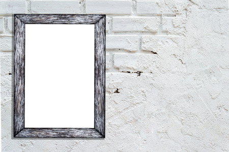 Blank white frame on brick wall background with copy space, nice brick show room, template mock up for adding your design and adding more text. (Clipping path included)の写真素材
