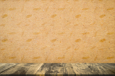 Empty wood table top and old paper background with copy space, used for display or montage your products.の写真素材