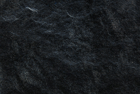 Dark grey black slate background or texture, Detailed of real genuine stone from nature, Can be used for creating surface effect to your designs or images.の写真素材
