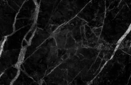 Black marble texture shot through with subtle white veining (Natural pattern for backdrop or background, Can also be used create surface effect to architectural slab, ceramic floor and wall tiles)の写真素材