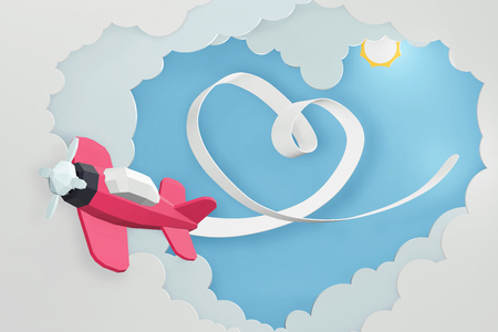 Paper art style of Heart ribbon with Pink plane flying in the sky, Romantic, sweet, cute, Perfect Valentineâs Day Cards for the loved ones in your life, 3D rendering design.の写真素材