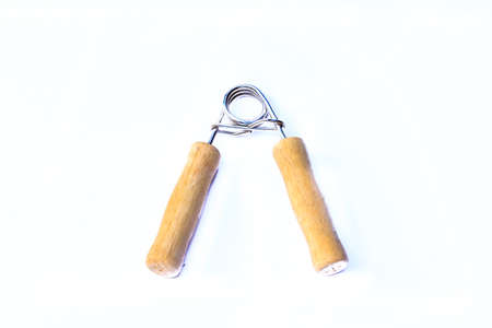 hand grippers on white background - fitness conceptの写真素材