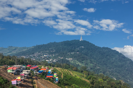 group of houses along road in slope on mountainの写真素材