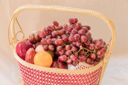 Fresh autumn fruits - rose apple, grapes,orange and applesの写真素材