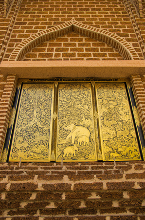 Temple in Thailand A window with many beautiful decorative art.の写真素材