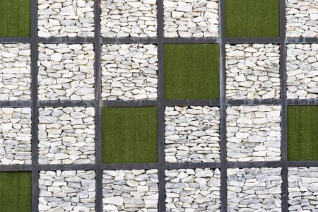 Pattern  of rocks and plants in square.