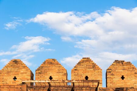old wall  and clouds on blue skyの写真素材