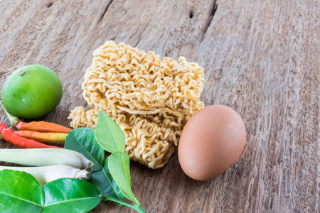 Combine soup spicy herbs Thai Food Tom Yum on wooden tablesの写真素材