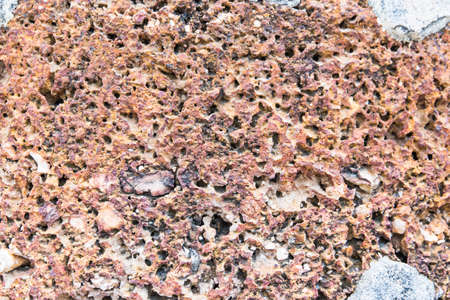 Red and yellow laterite wall backgroundの写真素材