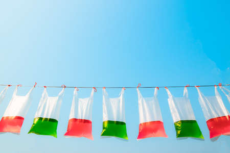 Sweet drink in plastic bag  on blue backgroundの写真素材