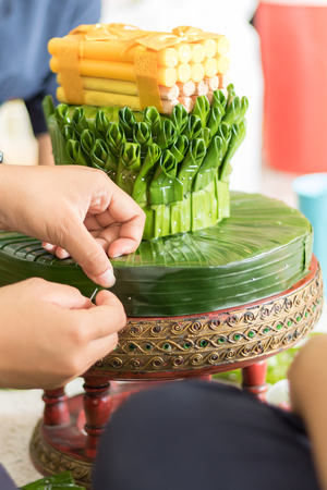 Woman modelling artificial flower from banana leafの写真素材