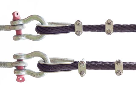 Wire rope binding. Cable linked together by steel clamp.