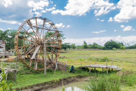 Water-wheels turbine rotating in the gardenの写真素材