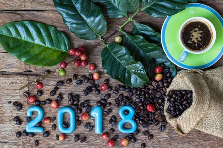 2018 with Red Coffee Bean Shaped, New Year Concept, Mixed Coffees Robusta and Arabicaの写真素材
