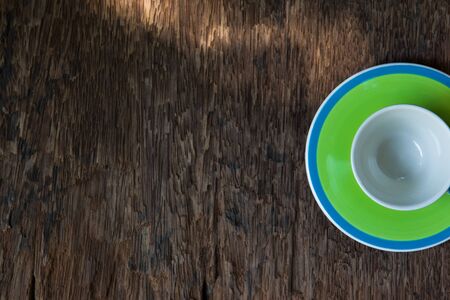 the empty cup on wooden background.の写真素材