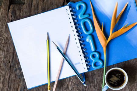 ceramic numbers forming the number 2018, For the new year 2018 on a old wooden background.の写真素材