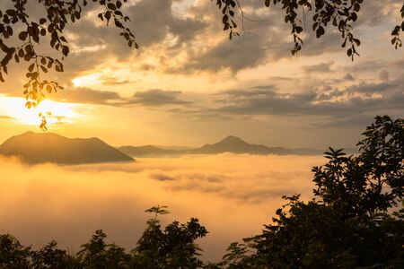 Beautiful sunrise sky above  Mountain range with visible silhouettes through the morning colorful...