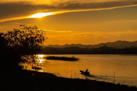 Beautiful sunrise sky above  Mountain range with visible silhouettes.の写真素材