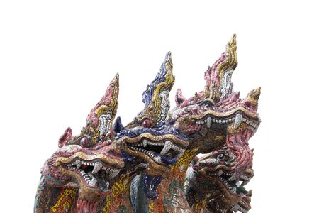 Many Naga Heads isolated on white background. Naga heads along the Naga steps in Buddhist temples are dramatically ornamented and extensively used in Thai temples or Wat Thai.の写真素材