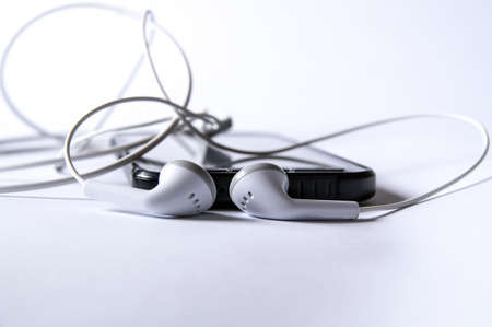 smartphone with headphones for listening to musicの写真素材