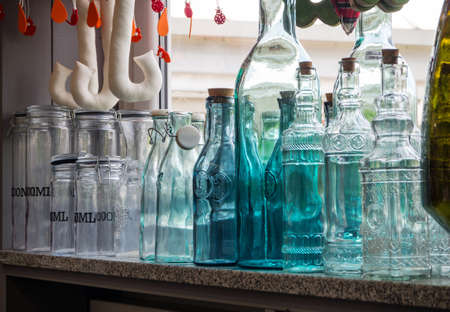 decorative bottles and jars on the window sill, kitchen decorationの写真素材