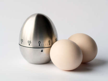 eggs as ingredients and a timerの写真素材