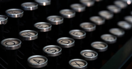 A Closeup image of the keys and keyboard of an old style typewriter
