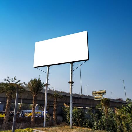 Blank billboard at roadside good viewership against clear skyの写真素材