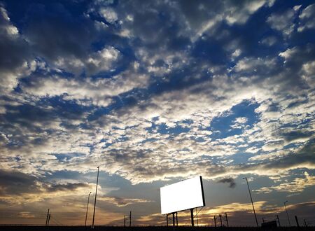 Dramatic cloudy sky natural background and advertising billboardの写真素材