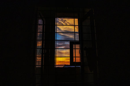 Dramatic sky looking through the windowの写真素材
