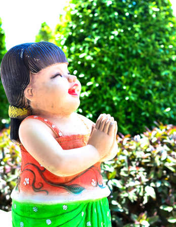 Women respect a statue.の写真素材