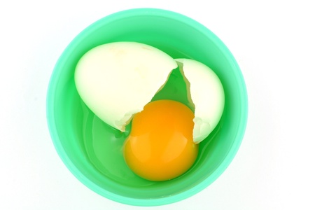 Cracked egg in cupの写真素材