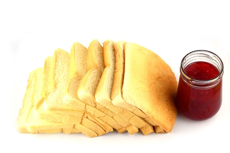Rusk with strawberry jam on white backgroundの写真素材