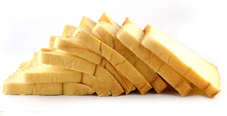 The cut loaf of bread on white backgroundの写真素材