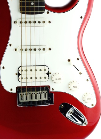 Red electric guitar on white の写真素材