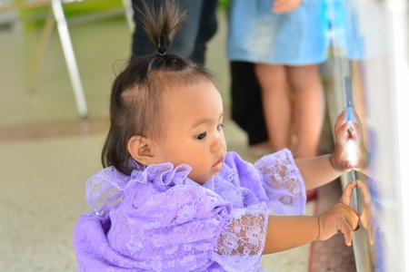 asian baby girl wearing thai dress