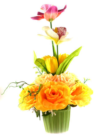 Multicolored flowers in a vase, isolated on white background の写真素材