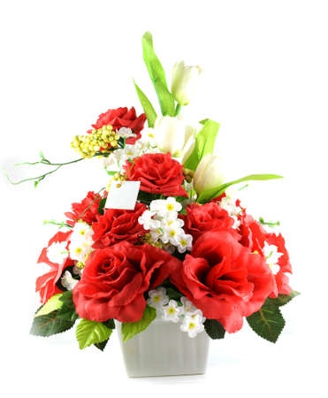 Multicolored flowers in a vase, isolated on white background の写真素材